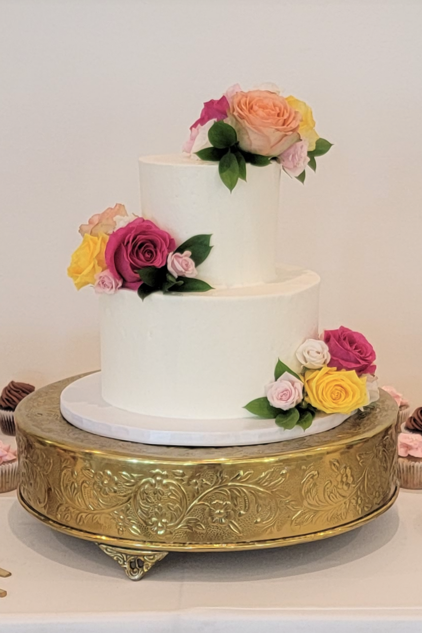 Classic buttercream wedding cake with flat top edge
