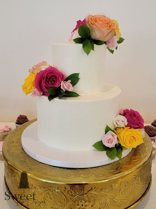 White buttercream wedding cake by Sweet By Design in Melissa Texas