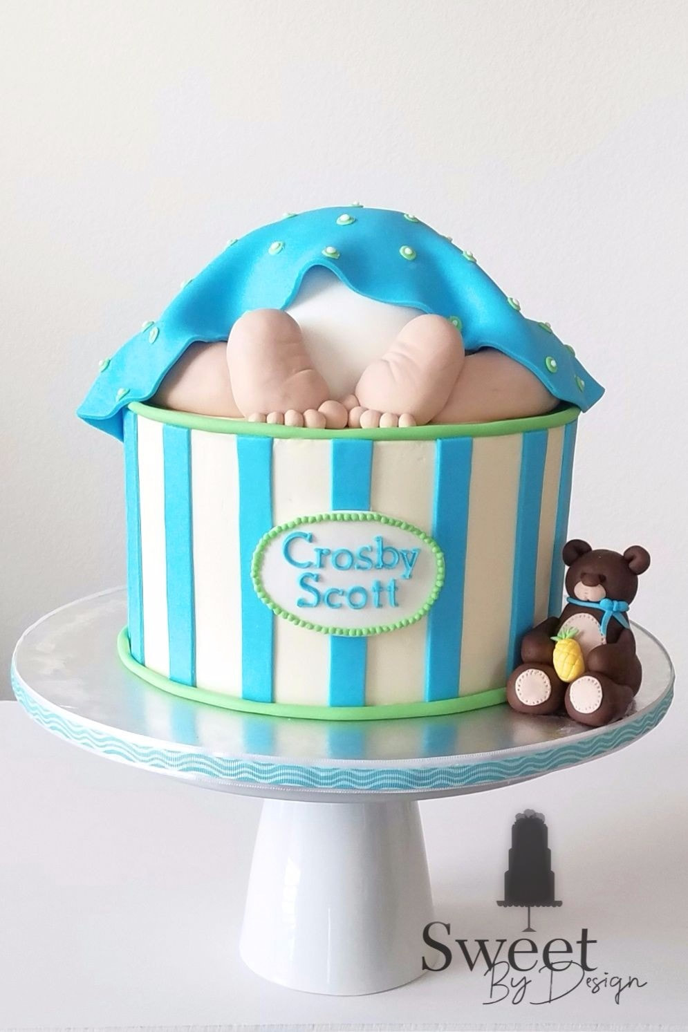 Baby under blanket baby shower cake by Sweet By Design