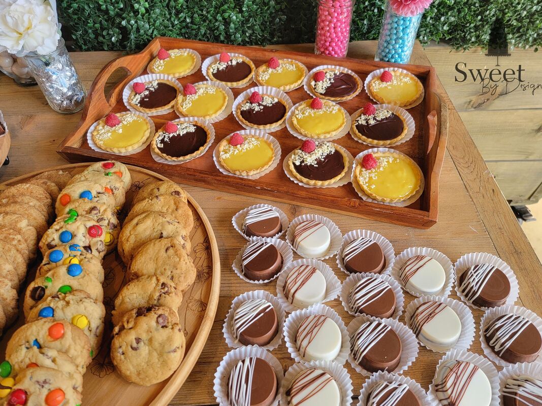 Wedding dessert table - cookies, tarts, chocolate covered oreos