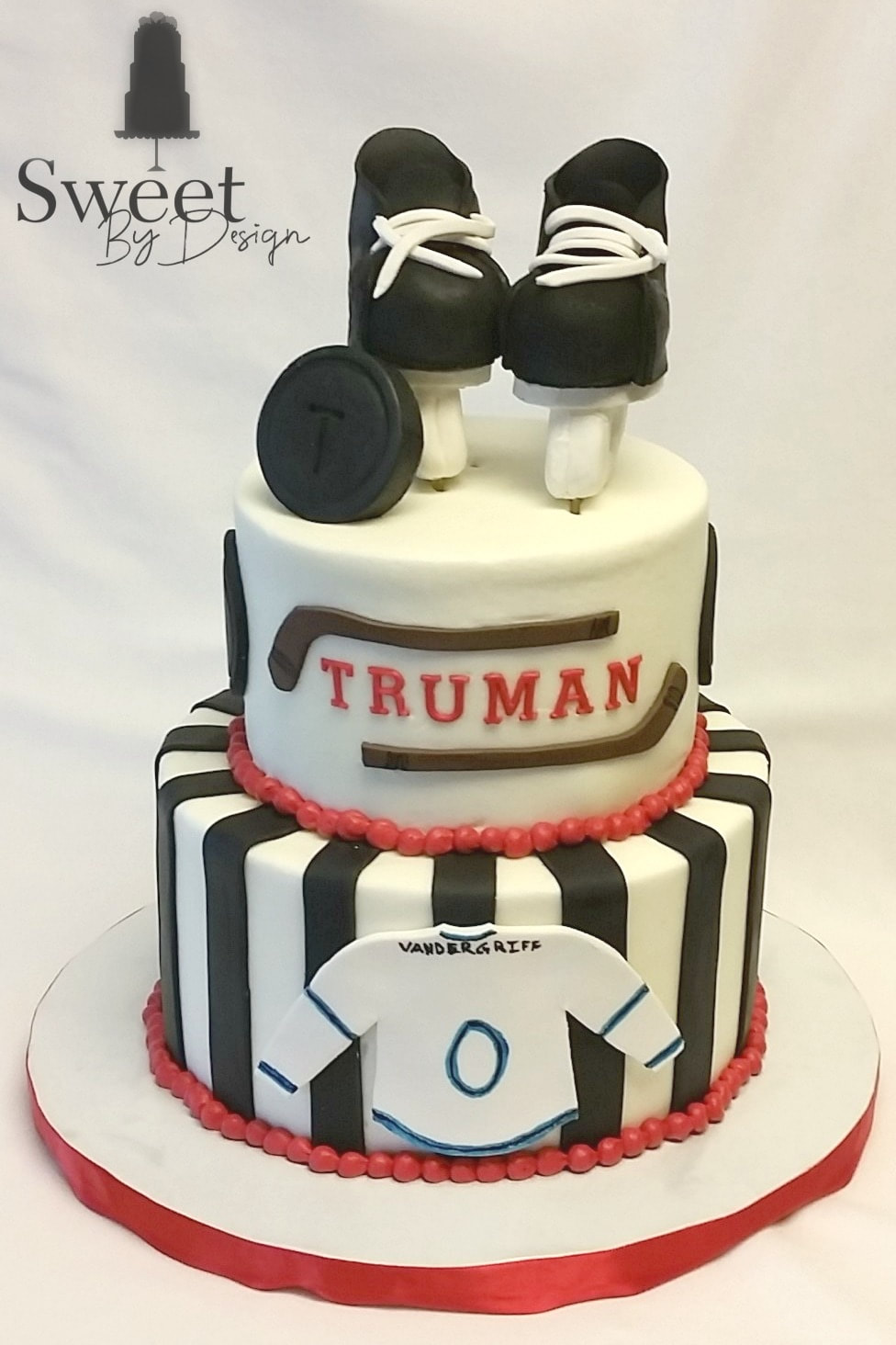 Hockey baby shower cake by Sweet By Design