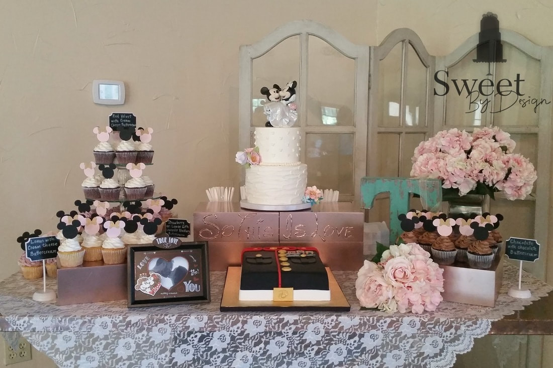 Cake table with cupcakes by Sweet By Design
