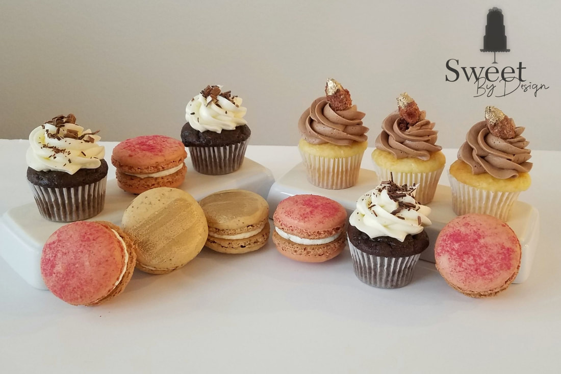 Mini cupcakes and macarons by Sweet By Design