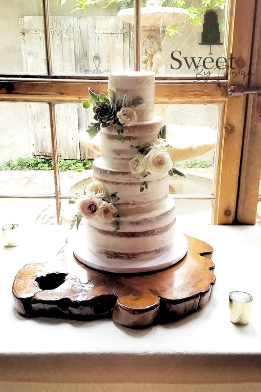 Naked wedding cake with roses and succulents by Sweet By Design