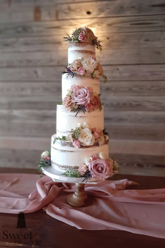 Naked wedding cake with fresh flowers by Sweet By Design