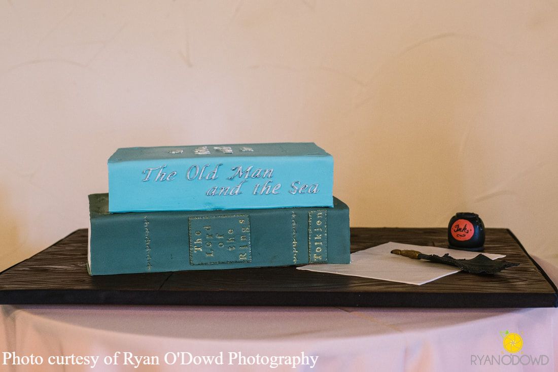 Stack of books groom's cake by Sweet By Design